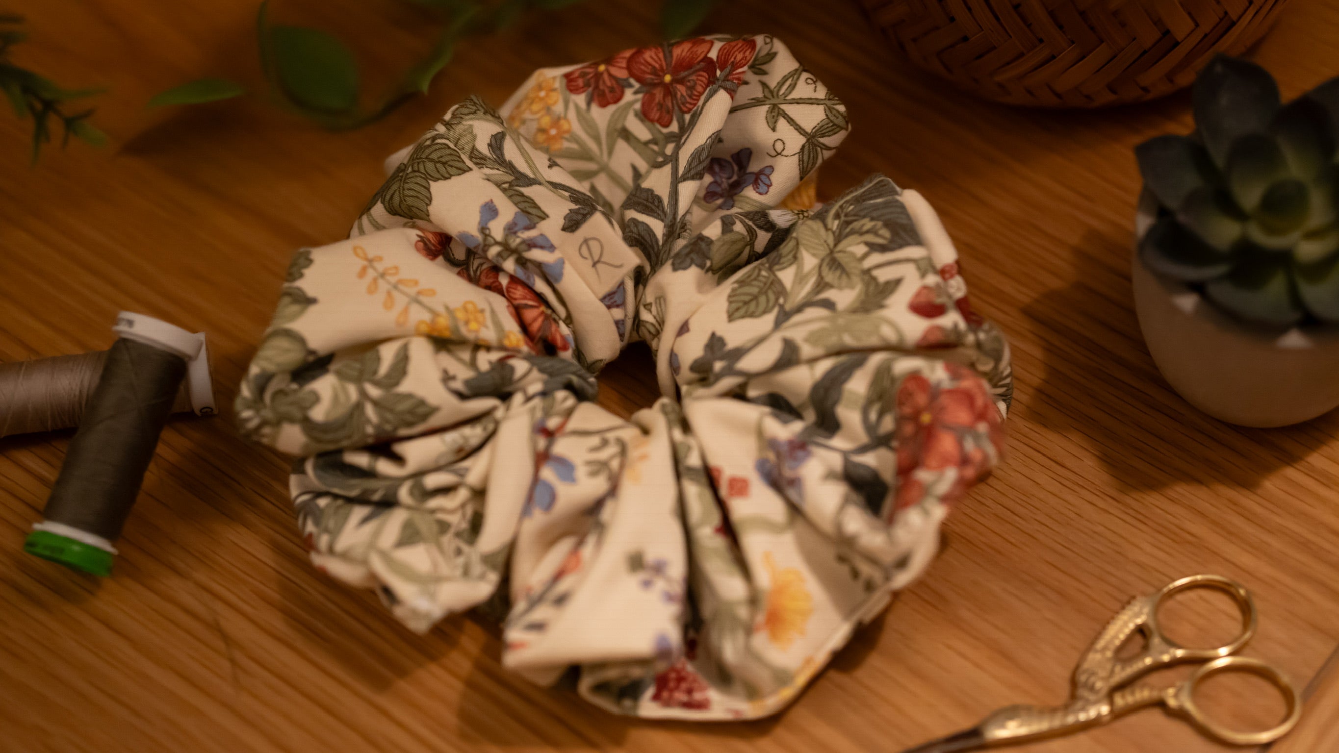 A large fabric scrunchie on a wooden surface