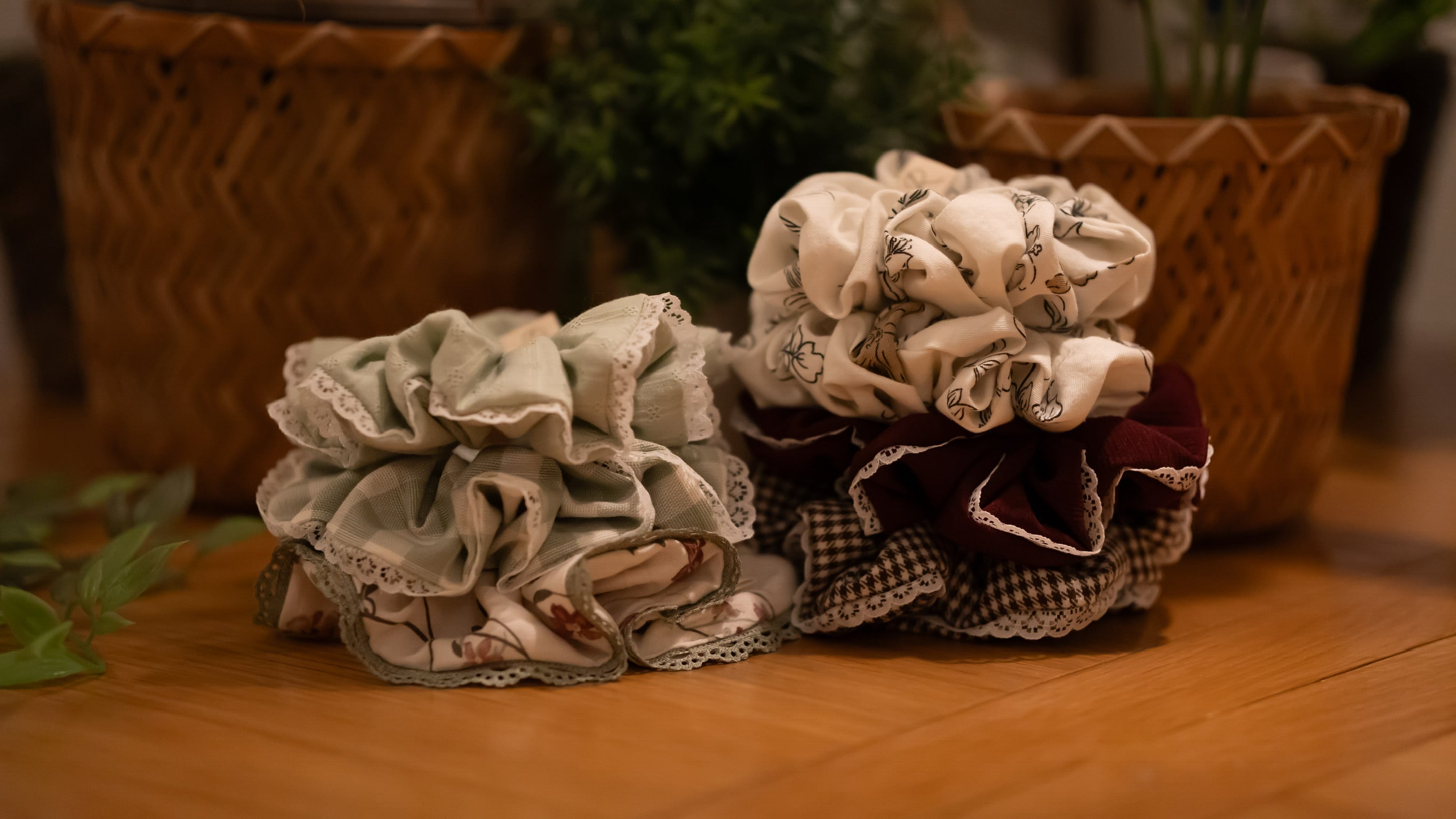 Two stacks of scrunchies on a wooden surface