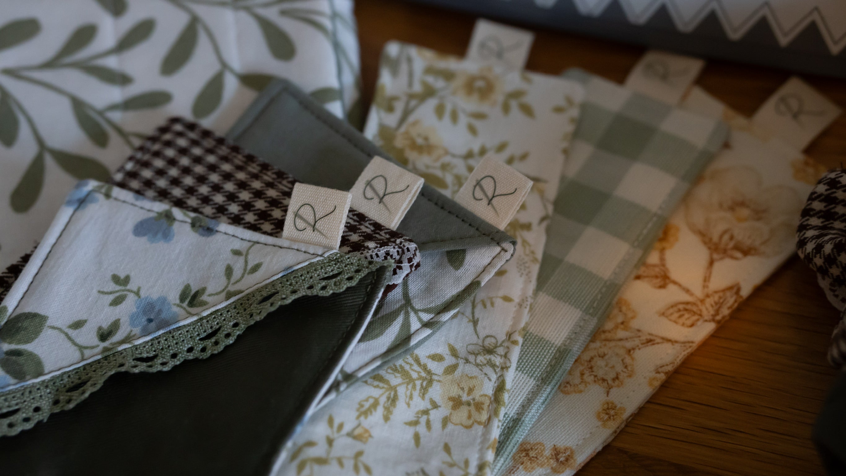A selection of fabric bookmarks in square and rectangular shapes