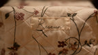 Floral-patterned fabric with a 'Resewn' label