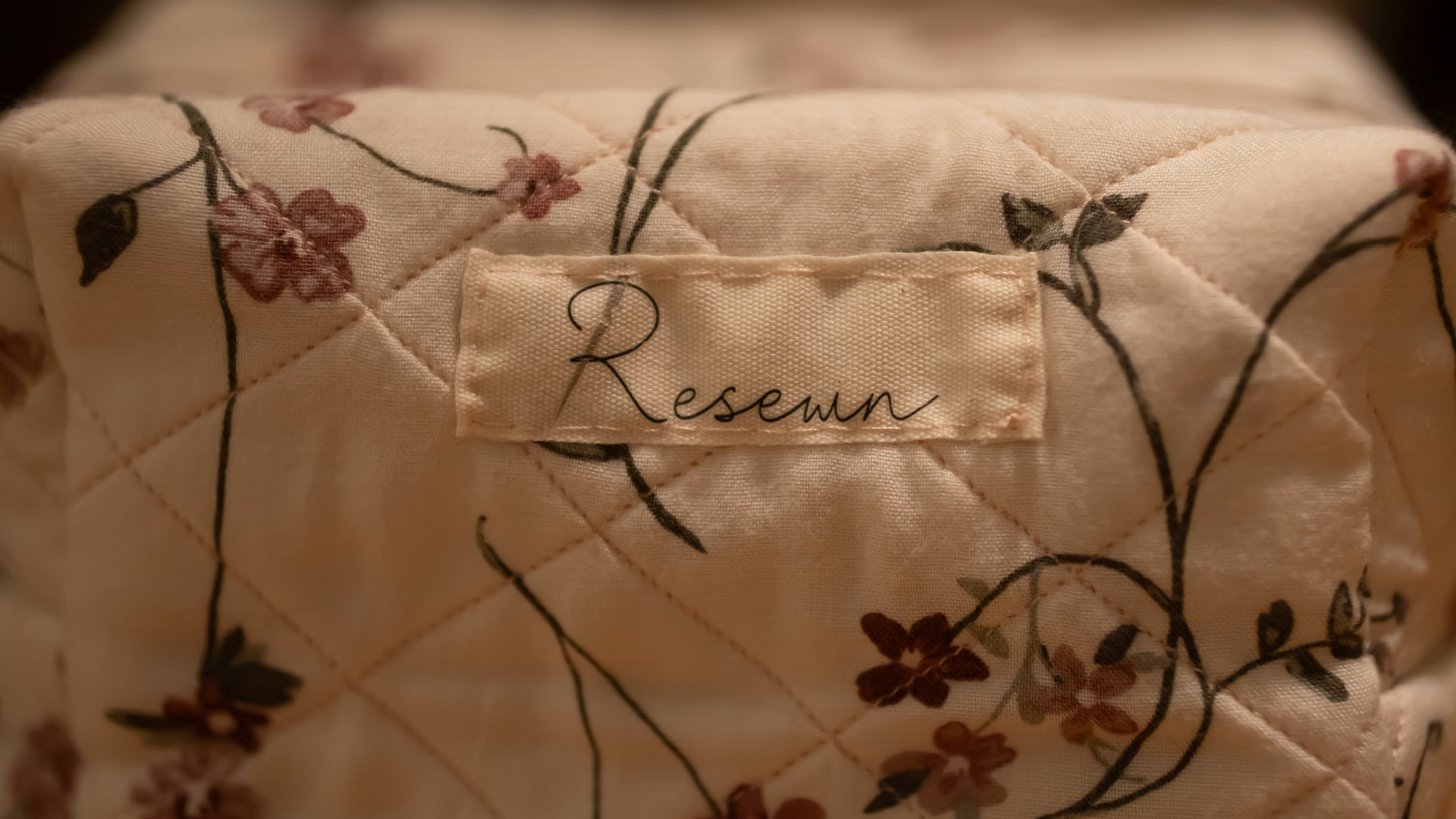 Floral-patterned fabric with a 'Resewn' label