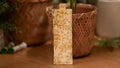 Fabric bookmark with floral pattern on a wooden surface
