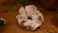Scrunchie with floral pattern on a wooden surface