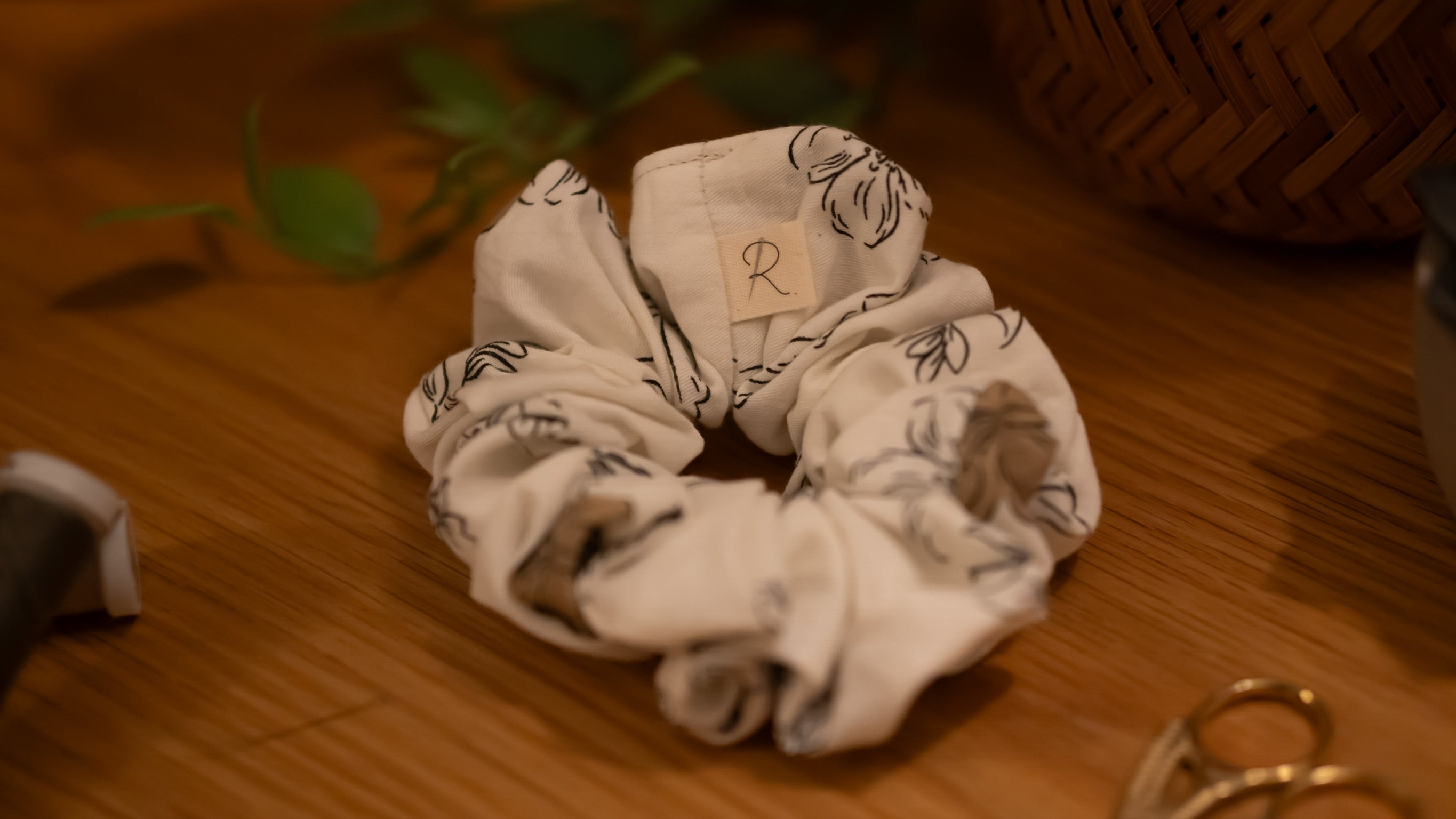 Scrunchie with floral pattern on a wooden surface